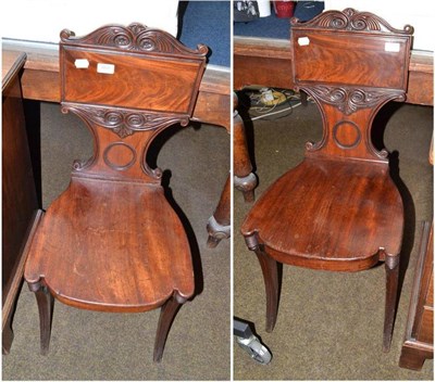 Lot 669 - Pair of Regency mahogany hall chairs