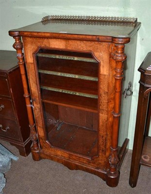 Lot 671 - A Victorian burr walnut music cabinet with glazed door and gilt metal fittings