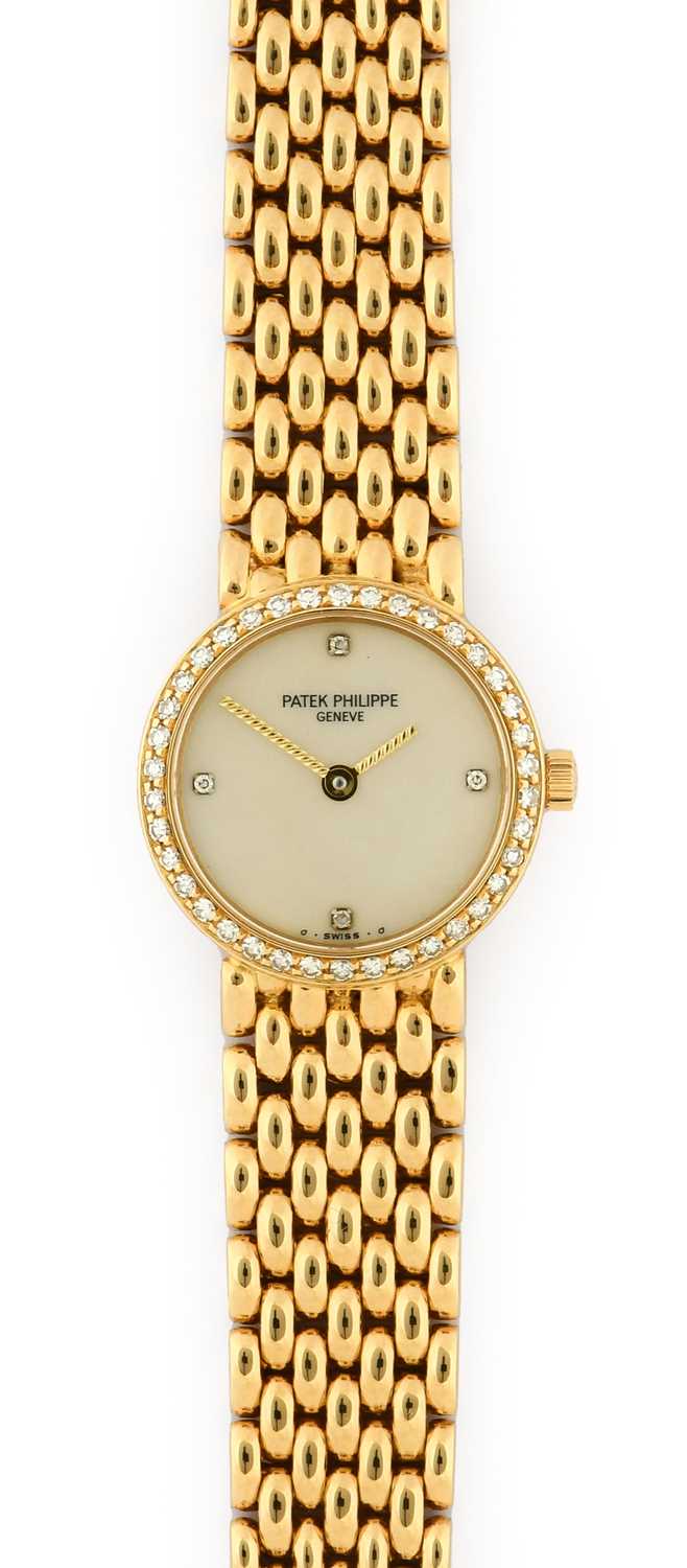 Lot 2256 - Patek Philippe: A Lady's 18 Carat Gold Diamond...