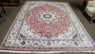 Lot 1100 - An Indian Carpet, the field of vines centred...