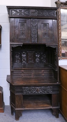 Lot 1213 - A Carved Oak Cupboard (Adapted), composed of...