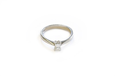 Lot 99 - A Platinum Diamond Solitaire Ring, the emerald...