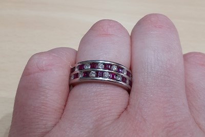 Lot 2019 - A Ruby and Diamond Ring two rows formed of...