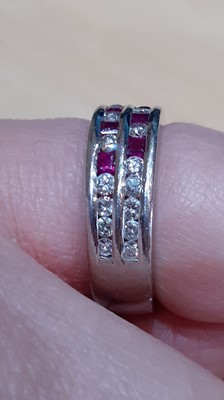 Lot 2019 - A Ruby and Diamond Ring two rows formed of...