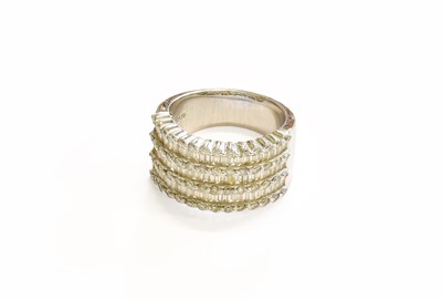 Lot 80 - A Diamond Ring, three rows of baguette cut...