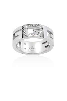 Lot 2018 - A Diamond Ring, by Gucci the central G motif...