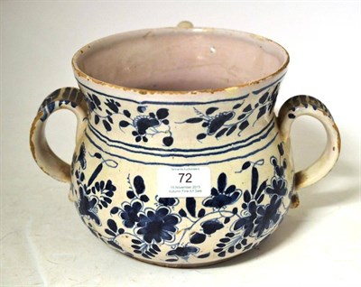 Lot 72 - An English Delft Posset Pot, circa 1720, of baluster form with twin strap handles and curved spout