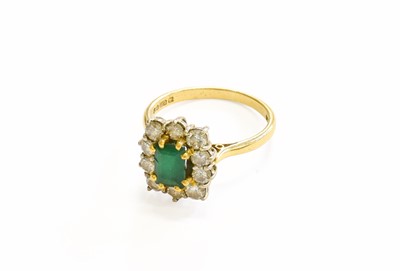 Lot 66 - An 18 Carat Gold Emerald and Diamond Cluster...