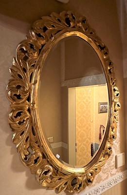 Lot 158 - A Gilt and Gesso Oval Wall Mirror, modern, the...