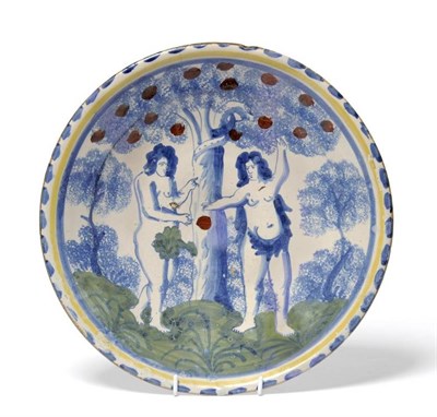 Lot 74 - A London Delft Adam and Eve Charger, possibly Norfolk House, circa 1710, painted in colours...