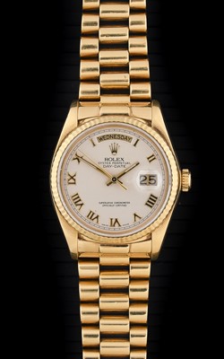 Lot 2246 - Rolex: An 18 Carat Gold Automatic Day/Date...
