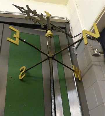 Lot 766 - A Victorian parcel gilt black painted wrought iron weather vane on a pole