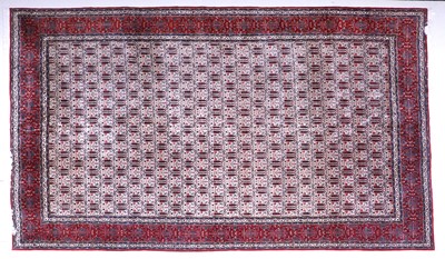 Lot 64 - Iranian Carpet, circa 1970 The ivory lattice...