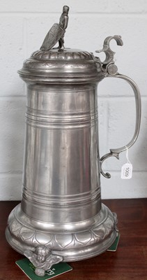 Lot 1009 - A Large Pewter Guild Flagon, 55cm high