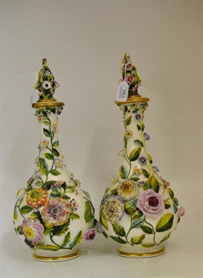 Lot 76 - A Pair of Rockingham Porcelain Bottle Vases and Stoppers, circa 1835, allover encrusted and painted