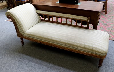 Lot 1232 - A Light Oak Framed Chaise Longue, set on...