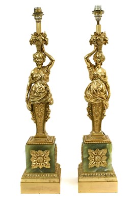 Lot 389 - A Pair of Gilt Bronze and Onyx Lamp Bases,...