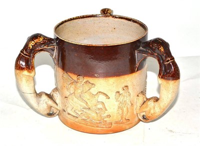 Lot 40 - A 19th century stoneware tyg with greyhound handles