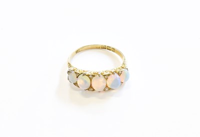 Lot 150 - An 18 Carat Gold Opal Five Stone Ring, the...