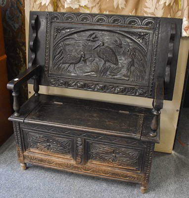 Lot 1253 - A Victorian Carved Oak Monk's Bench, the back...