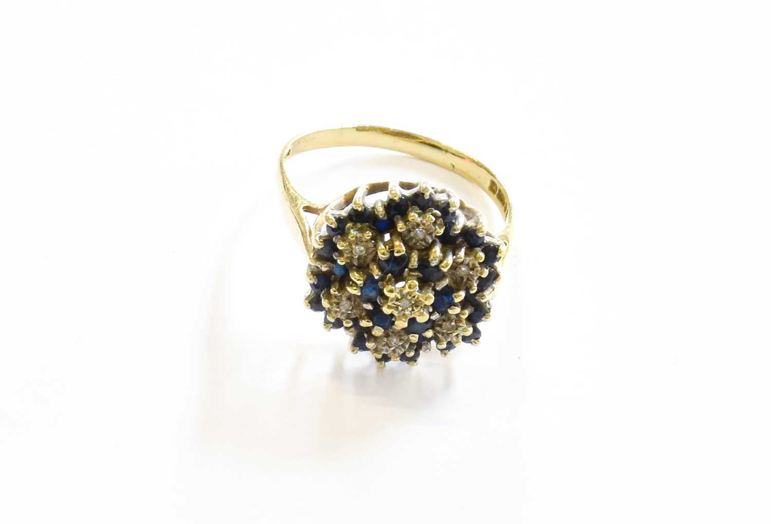 Lot 167 - An 18 Carat Gold Sapphire and Diamond Cluster...