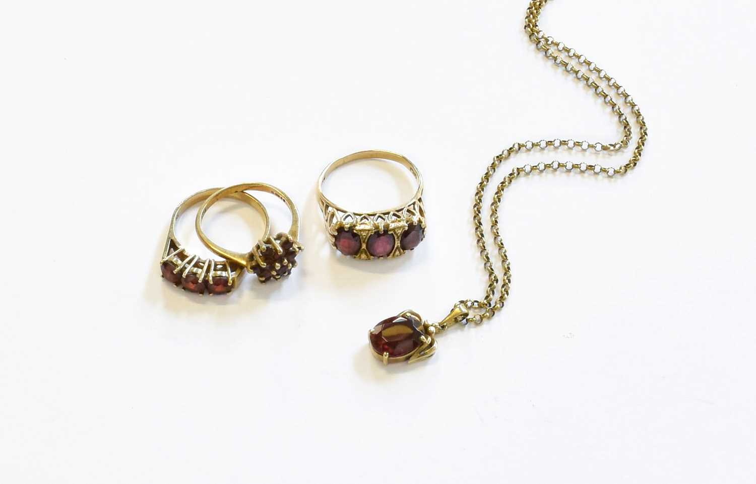 Lot 139 - Two 9 Carat Gold Garnet Rings, varying designs...