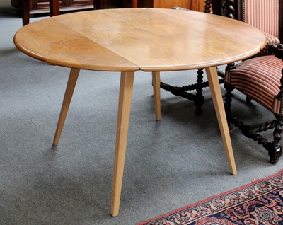 Lot 1366 - An Ercol Light Elm Drop Leaf Dining Table,...