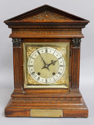 Lot 1005 - A German Oak Quarter Striking Table Clock,...