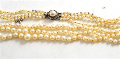 Lot 63 - A three row cultured pearl necklace