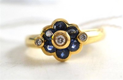 Lot 66 - A 9ct gold diamond and sapphire ring