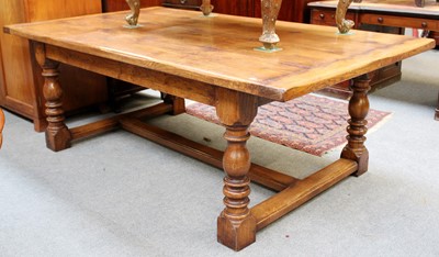 Lot 1382 - A 20th Century Oak Farmhouse Dining Table, the...