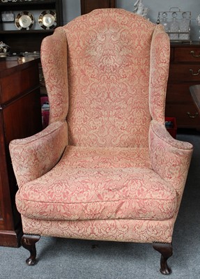 Lot 1421 - A Georgian Style Wing Back Chair