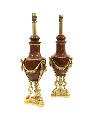 Lot 555 - A Pair of Gilt Metal Mounted Rouge Marble Lamp...