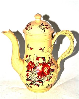 Lot 84 - A Leeds Creamware Coffee Pot and Cover, 18th century, decorated in iron red and black with...
