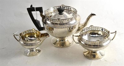 Lot 96 - Three piece silver tea set with pierced decoration