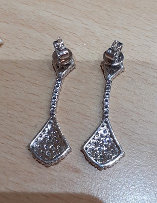 Lot 2071 - A Pair of Diamond Drop Earrings two fan motifs...