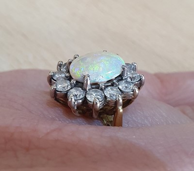 Lot 2044 - An 18 Carat Gold Opal and Diamond Cluster Ring...