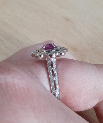 Lot 2046 - A Pink Sapphire and Diamond Cluster Ring the...