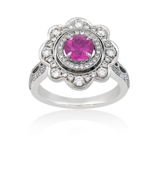 Lot 2046 - A Pink Sapphire and Diamond Cluster Ring the...