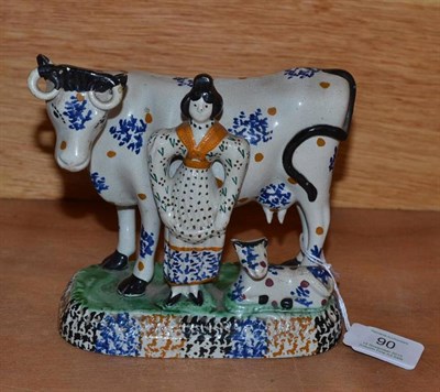Lot 90 - A Prattware Pottery Cow, Calf and Milkmaid Group, probably Yorkshire, circa 1800, the cow and...