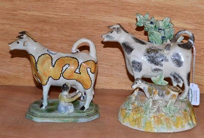 Lot 91 - A Pratt Pottery Cow Creamer, circa 1800, the standing beast with yellow curvaceous coat...