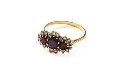 Lot 17 - An 18 Carat Gold Synthetic Ruby and Diamond...