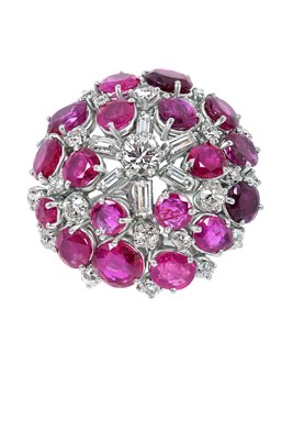 Lot 2043 - A Ruby and Diamond Cluster Ring the central...