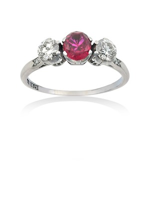 Lot 2254 - A Ruby and Diamond Three Stone Ring the round...