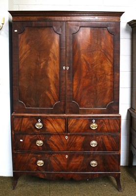 Lot 1253 - A George III Mahogany Linen Press, with dentil...