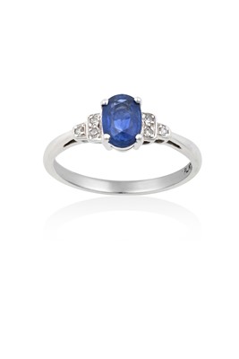 Lot 2070 - A Sapphire and Diamond Ring the oval cut...