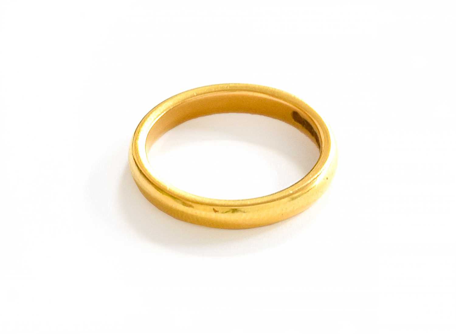 Lot 67 - A 22 Carat Gold Band Ring, finger size K