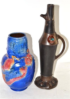 Lot 214 - A Bretby vase, shape No. 2022, moulded with dragons, on a blue ground, impressed factory marks...