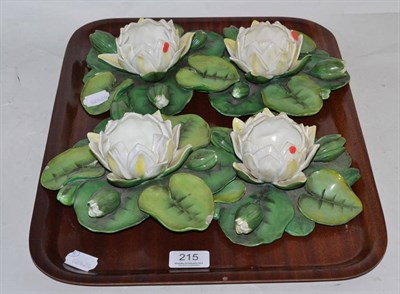 Lot 215 - Four Moore lily pads impressed 'T Goode & Co'