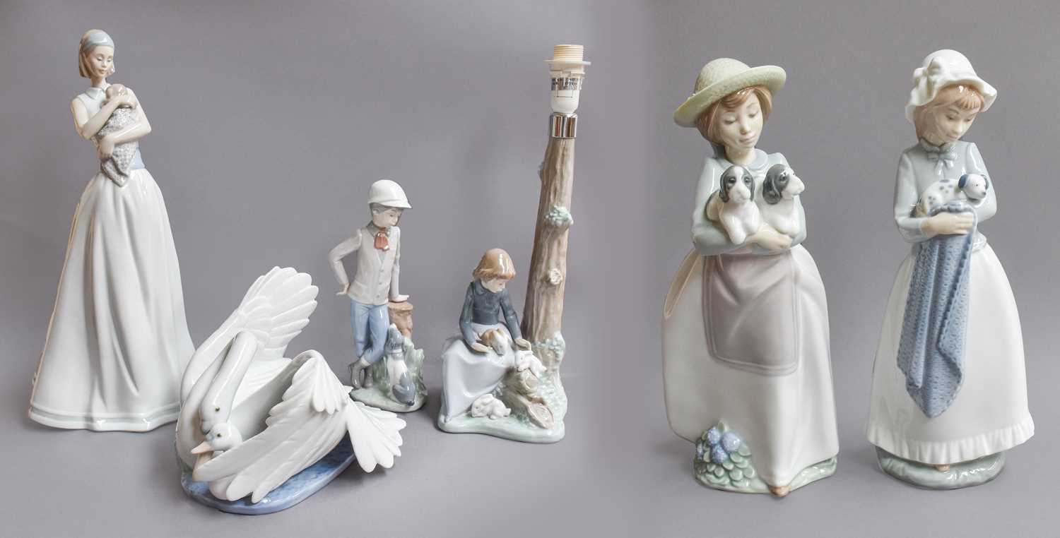 Lot 163 - Nao figures to include a lamp base of a girl